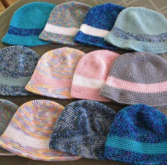 Photo: I never sent off the last 7, but added 5 more. So these 12 hats are leaiving on their journey across the US today. They will be boxed and at the post office in an couple of hours. <3 <3 <3